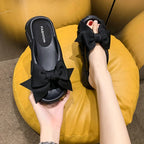 Tongs à semelle compensée avec nœud papillon pour femmes