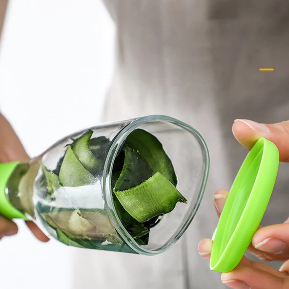 Économe de fruits et légumes avec résevoir