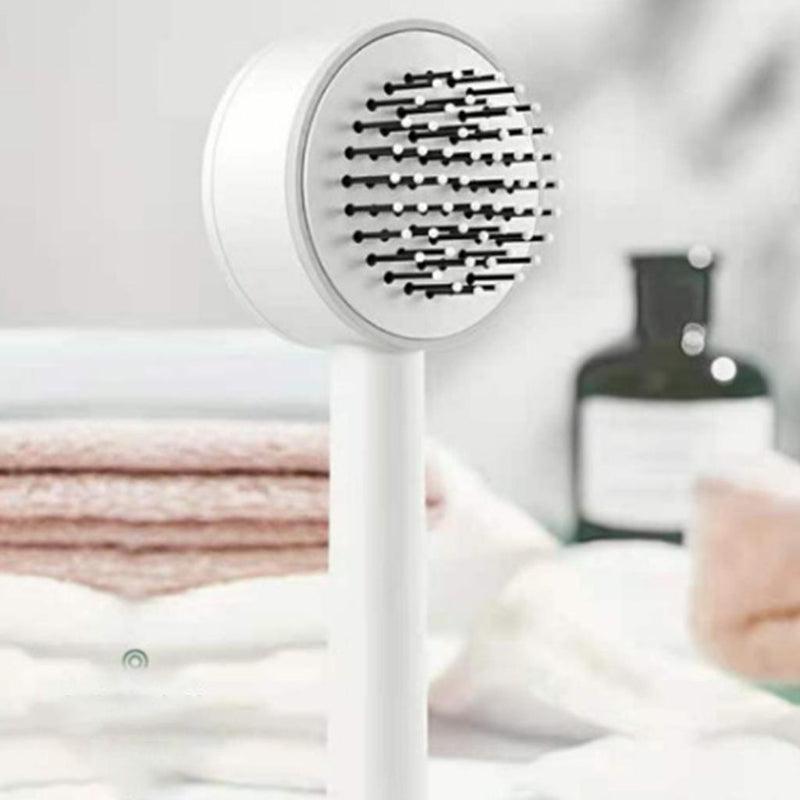 Brosse à cheveux auto-nettoyante